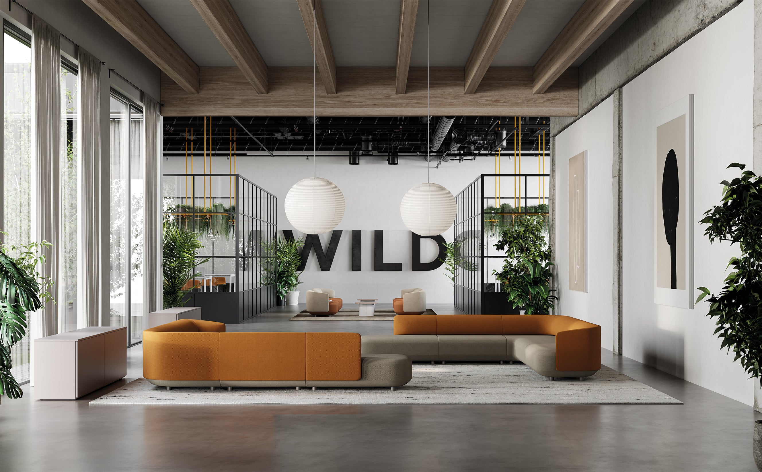 Salon de bureau moderne avec des canapés modulaires Afina de Ramos Bassols en orange et beige, de grandes lampes suspendues blanches, des plantes d'intérieur, la mention "WILD" sur le mur du fond et la lumière naturelle qui pénètre par les grandes fenêtres du côté gauche.