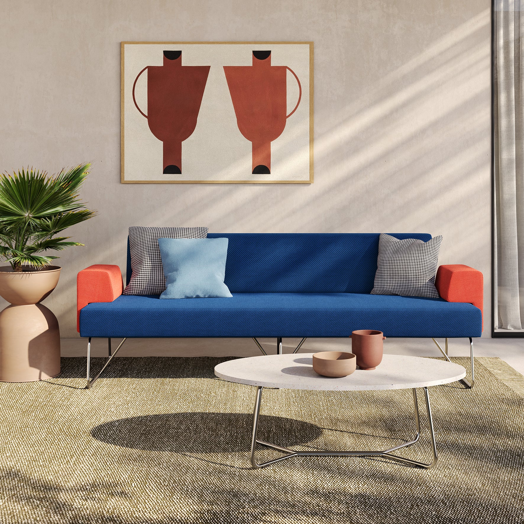 Un salon moderne avec les Canapés d'accueil Fedra de d.FLUX en bleu et orange, des coussins assortis, une table basse ronde blanche avec des céramiques, une plante en pot et de l'art mural géométrique abstrait dans des tons terreux.