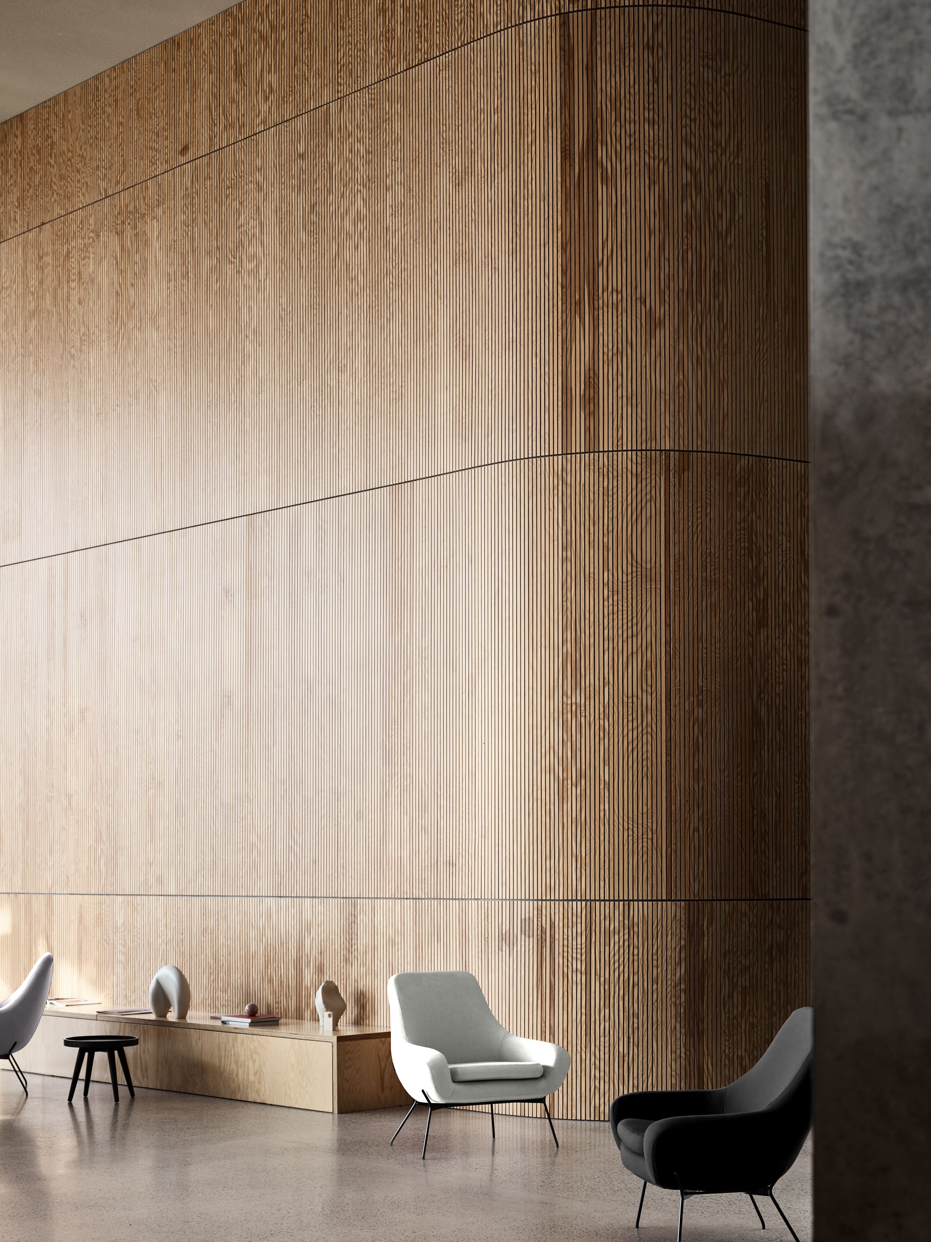 Un salon moderne et minimaliste avec les fauteuils Fauteuil NOOMI de Susanne Grønlund en blanc et gris foncé, des bases graphiques, des petites tables et un décor subtil, créant une atmosphère calme et sophistiquée dans un style contemporain.