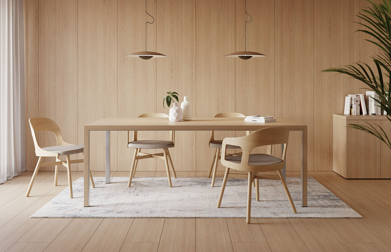 Le Neta Executive d'Attitudes Bureaux se compose d'une table en bois clair et de quatre chaises sur un tapis gris, avec des vases blancs, des livres, des lampes suspendues et une plante en pot - idéal pour ceux qui apprécient les espaces de travail modernes et les finitions raffinées.