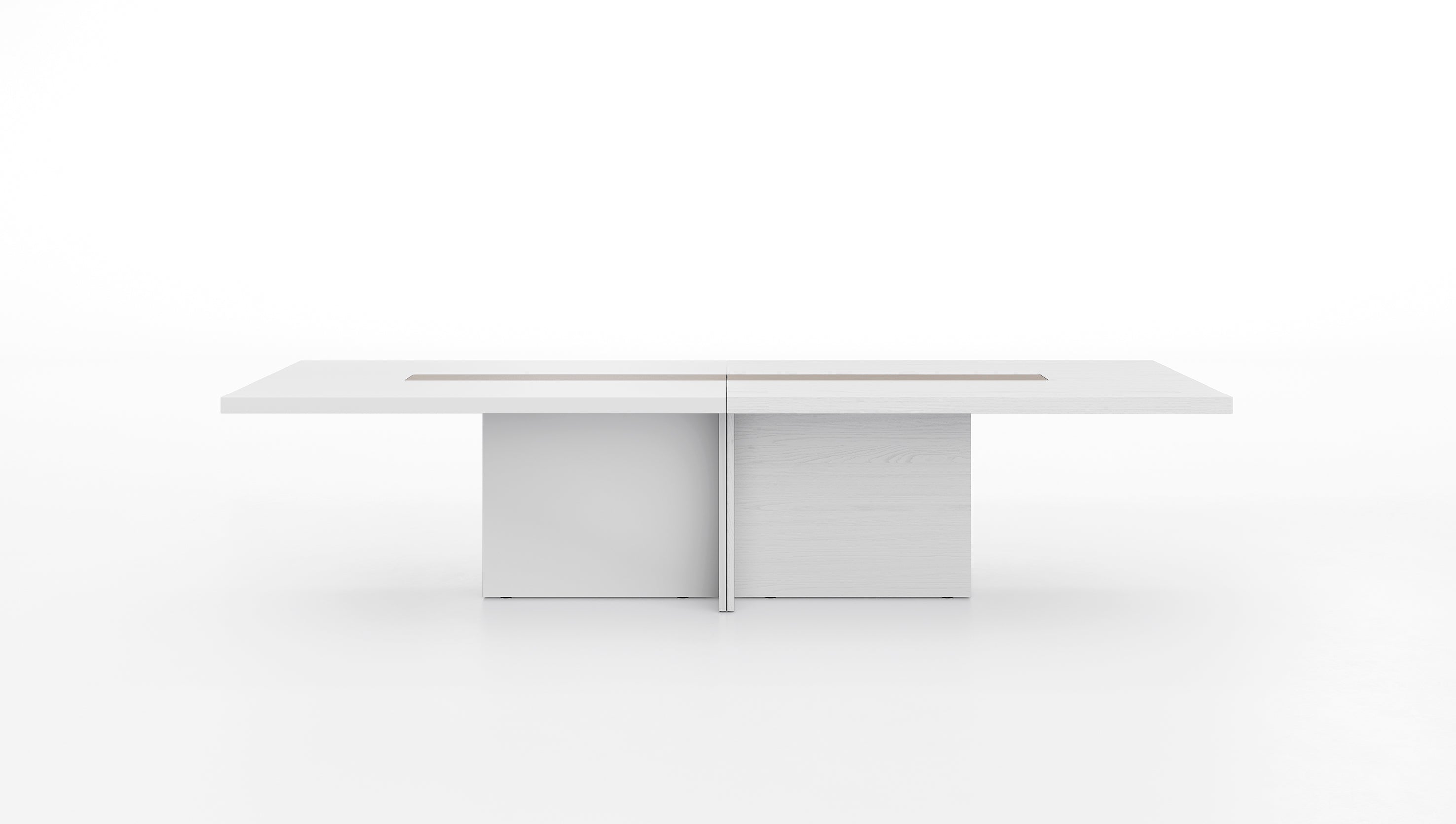 La table de réunion Mux70 de Stefano Boeri Interiors est une table blanche rectangulaire moderne aux lignes épurées, au design minimaliste, à la séparation verticale centrale et aux deux pieds en forme de blocs.